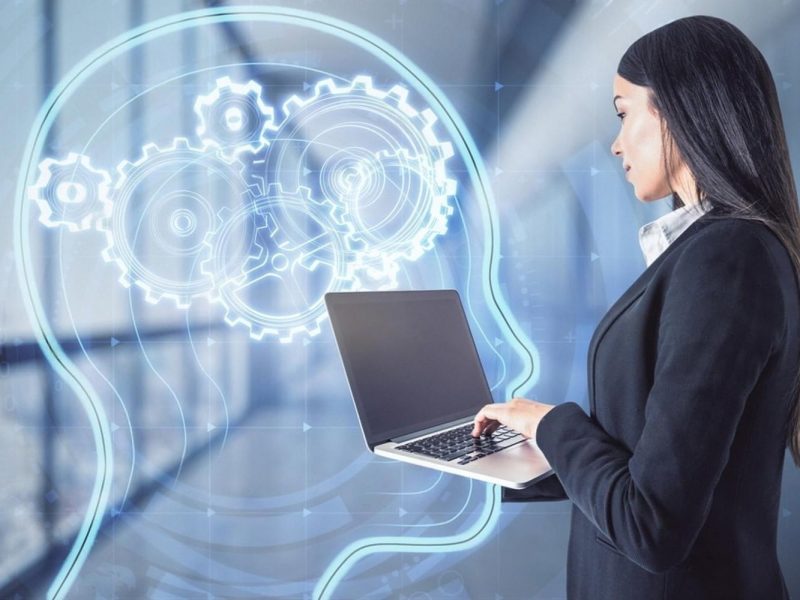 Analyst using AI on a laptop to review third-party vendor risk in a UAE office